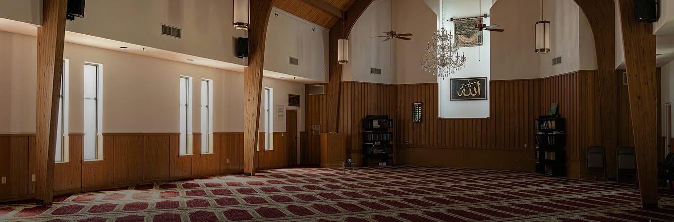Wooden arches and chandelier inside the Islamic Center of Southlake prayer hall